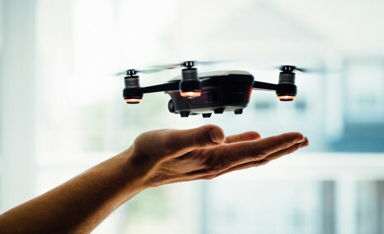 turned on black quadcopter drone