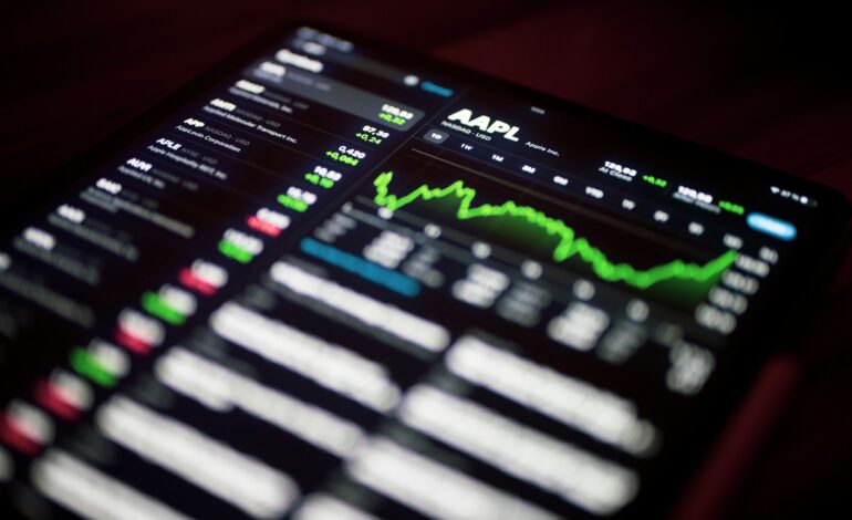 a close up of a cell phone with a stock chart on it
