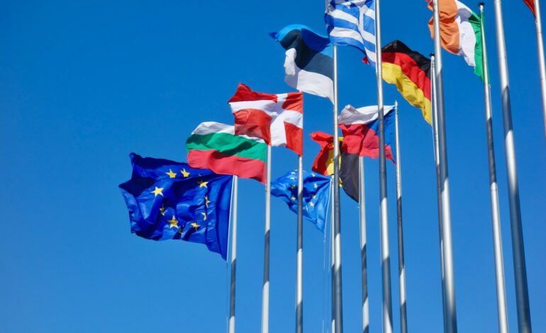 a bunch of flags that are flying in the air